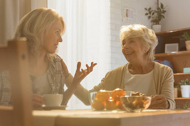istock Woman talking with old mother 637128320