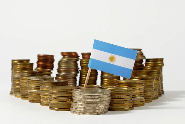 Argentina flag waving with stack of money coins