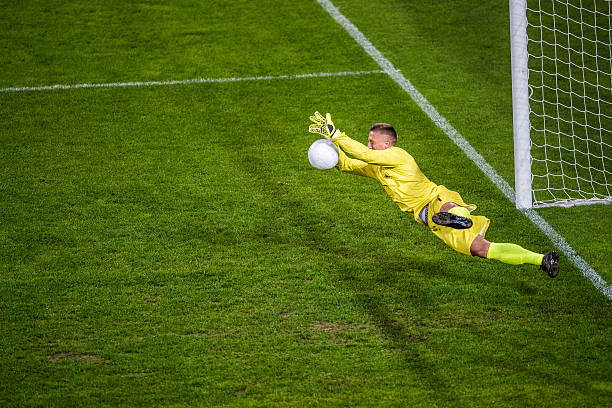 goalkeeper diving - action adult adults only ball imagens e fotografias de stock