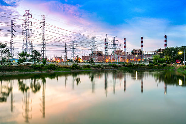 twilight foto von power plant - blurred motion bridge business blue stock-fotos und bilder