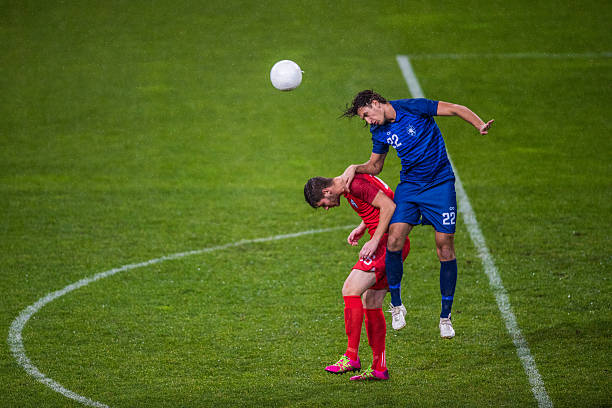 istock Soccer players heading 637133556