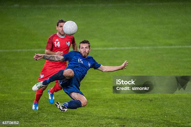 Football Players Playing Football Stock Photo - Download Image Now - Soccer, Soccer Player, Sport