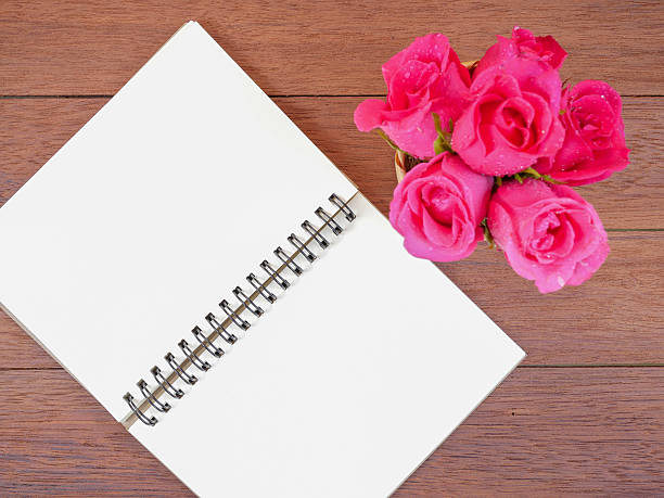 istock Bouquet pink rose flower and blank notebook 3 637137178