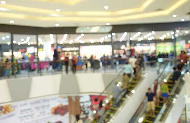 istock blurred image abstract people walking in shopping centre. 637137316