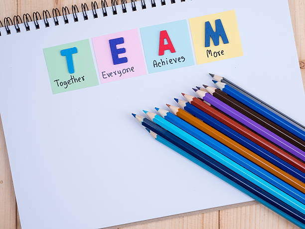 istock Word spelling TEAM and stack of color pencil 2 637137452