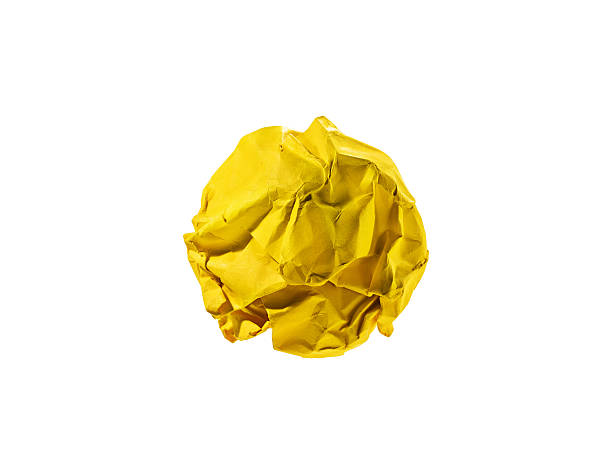Yellow crumpled ball on white.Idea concept.Clipping path. Yellow crumpled ball on white.For idea concept.Clipping path. crumpled paper ball stock pictures, royalty-free photos & images