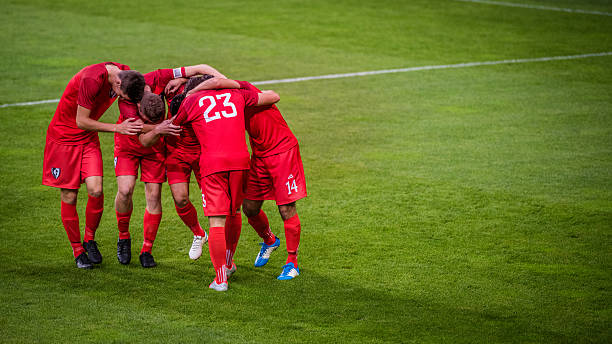 istock Football players celebrating 637140030