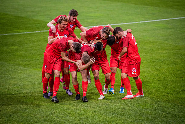 istock Football players celebrating 637140148