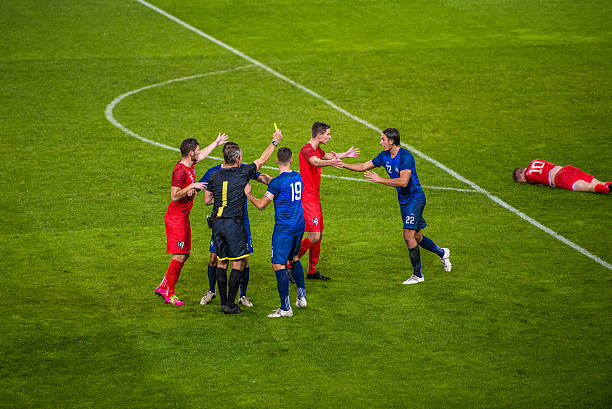 istock Football players arguing 637140300