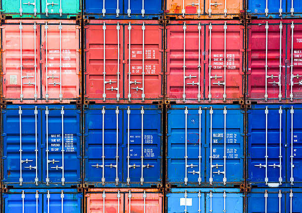 istock Four vertical rows of shipping containers 637140902