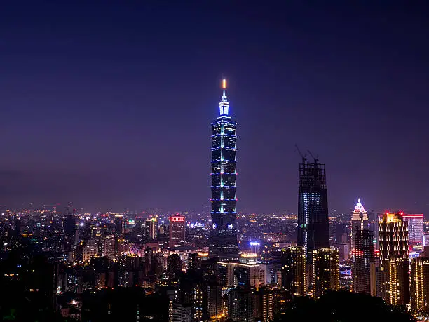 Cityscape nightlife view of Taipei. Taiwan city skyline at twilight time, public scene from view point at Elephant Mountain Hiking Trail in purple tone