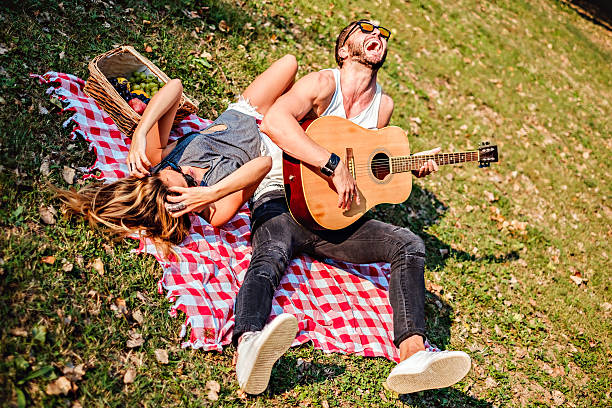 istock Couple laughing on a picnic 637142912