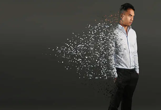 Man with pixel dispersion effect. Disintegration of body 