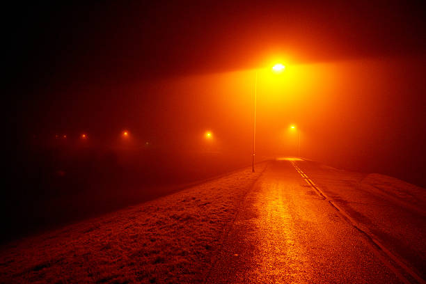 istock night road lit by streetlamps 637145576