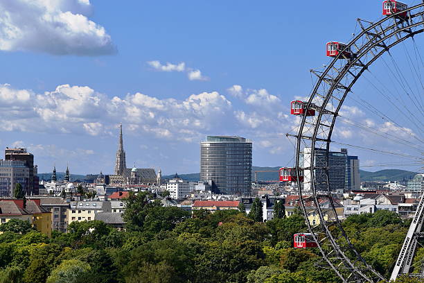 Vienna postcard A panoramic view of Vienna, Capital City of Austria, Europe. Ferris Wheel in Prater Entertainment Park on the right, St. Stephen’s Cathedral in the background. st. stephens cathedral vienna photos stock pictures, royalty-free photos & images