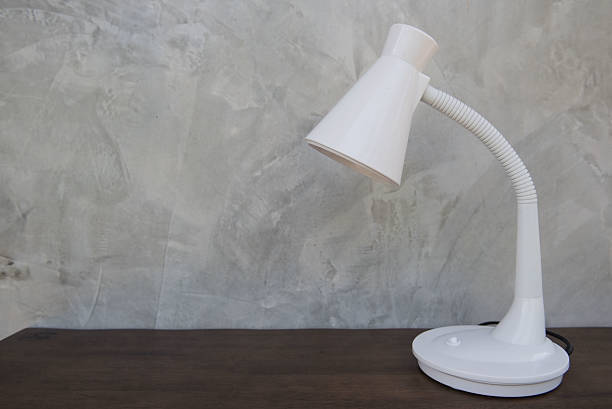 istock White Table lamp isolated on wooden table 637146072