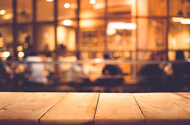 istock Wood table top on blurred of cafe ( restaurant ) 637146222