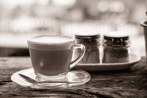 istock Hot coffee on old wood table black and white tone. 637146920