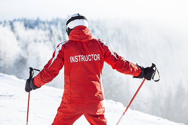 Ski instructor trains people Ski instructor trains people ski instructor stock pictures, royalty-free photos & images