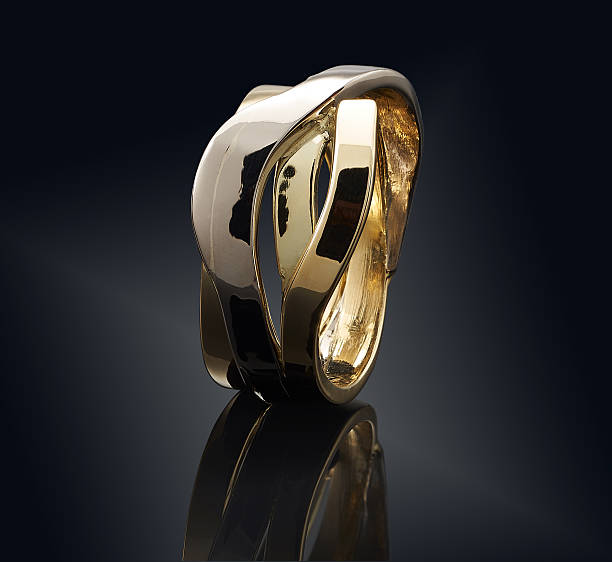istock beautiful Golden ring isolated on black background 637148562
