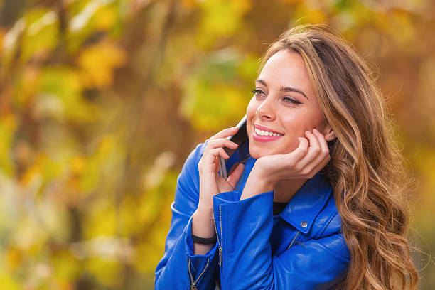 istock Girl using cellphone outdoors. 637149222