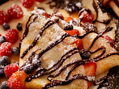 Crepes with Fresh Berries, Chocolate Sauce and Powdered sugar -Photographed on a Hasselblad H3D11-39 megapixel Camera System