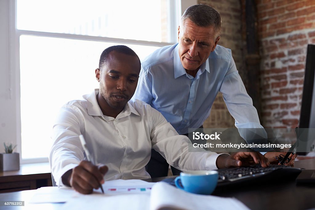 Businessmen Working On Computer In Office Role Model Stock Photo