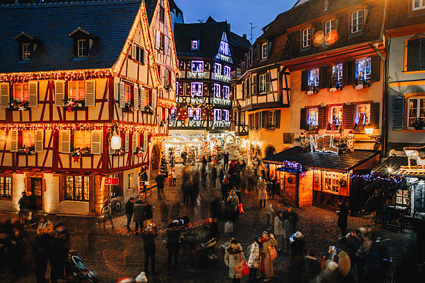 Christmas time in Colmar, Alsace, France Old town illuminated and decorate like a fairy tale in Christmas festive season in Colmar, Alsace, France bell tower tower stock pictures, royalty-free photos & images