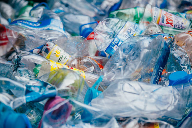 Plastic bottle recycling Stack of crushed colorful plastic bottles background waiting for recycle polyethylene terephthalate stock pictures, royalty-free photos & images