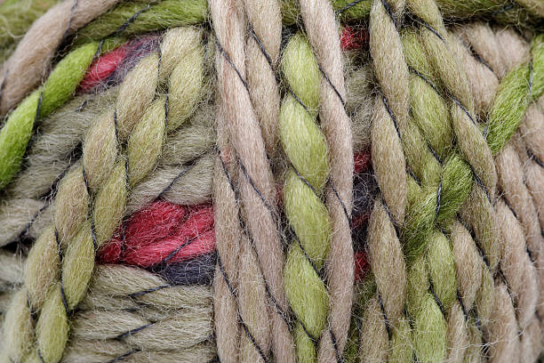 Multi-colored green merino wool yarn in fingering weight.  Isolated on a white background.