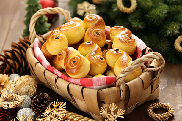 homemade swedish saffron buns, lussekatt in basket stock photo