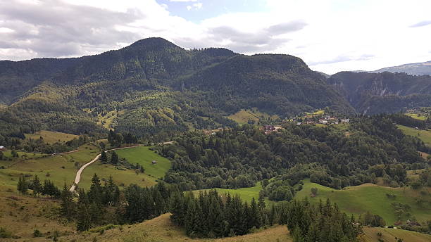 istock Summer day in the mountains with dark sky 637158426