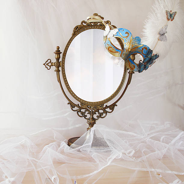 istock delicate blue venetian mask next to old vintage oval mirror 637160232