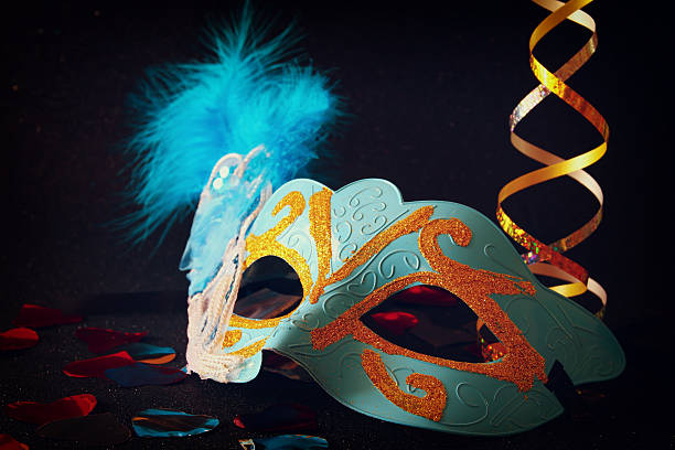 istock elegant venetian, mardi gras mask on glitter background 637160296