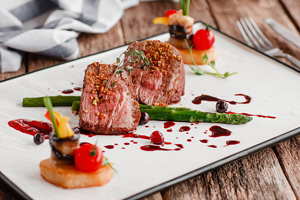 Delicate medallions of veal with vegetables Food Gourmet Veal Medallions Luxury Lifestyle Expensive Restaurant Recipe Serving Concept main course stock pictures, royalty-free photos & images