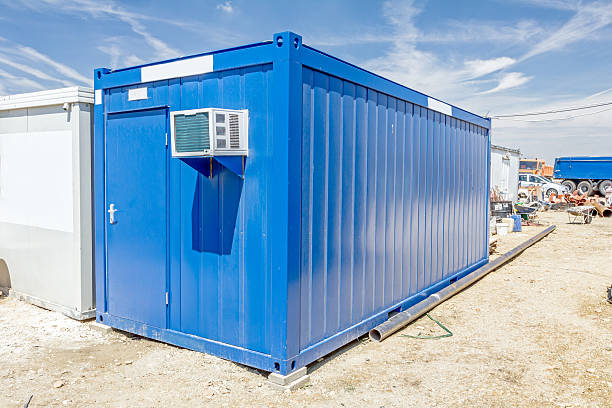 Air compressor is set on the wall of container office