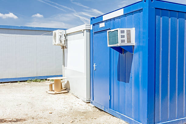istock Air compressor is set on the wall of container office 637163616