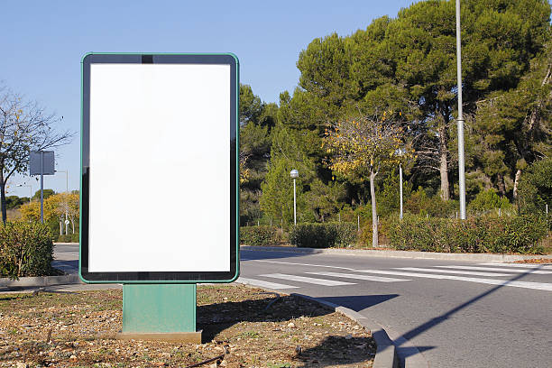 istock Blank billboard in a green street 637165574