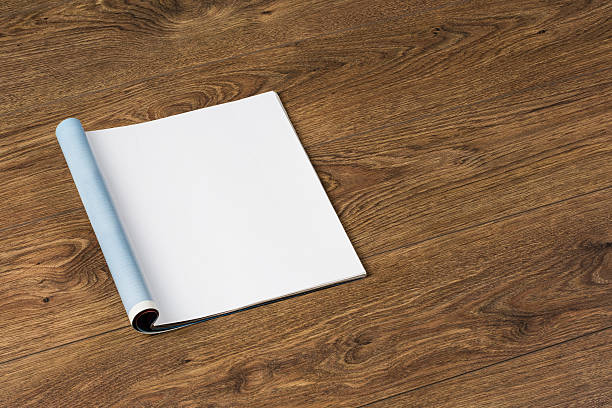 istock Mock-up magazines or catalog on wooden table background. 637166162