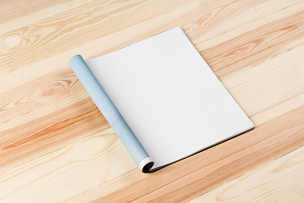 istock Mock-up magazines or catalog on wooden table background. 637166662
