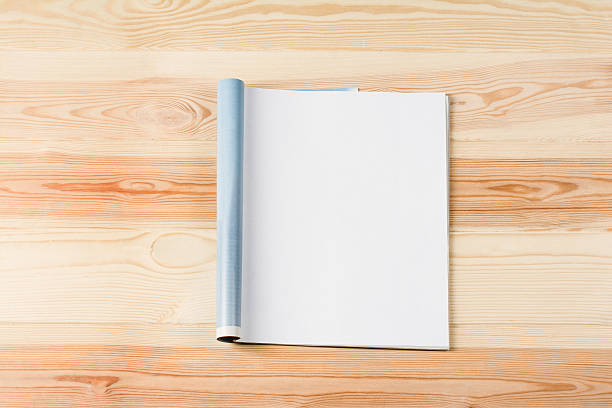 istock Mock-up magazines or catalog on wooden table background. 637166798