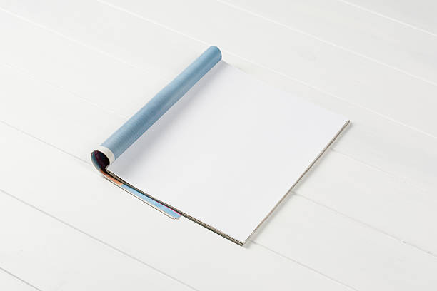 istock Mock-up magazines or catalog on wooden table background. 637167156