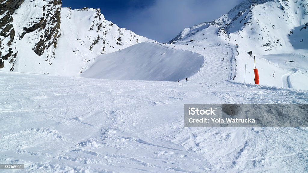 Mogul slope with fresh snow in high mountains Snowy mogul slope on top of mountains, French Alps Mogul Skiing Stock Photo