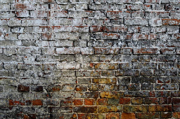 istock Texture of old red brick wall surface with cement 637169832