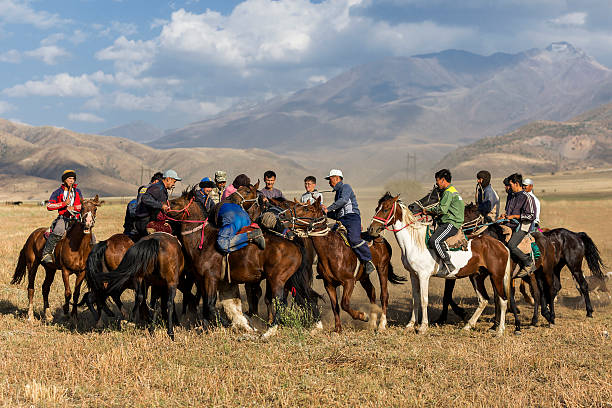 Nomadic horsegame Aksu, Zhabagly, Kazakhstan - September 9, 2016: Kazakh horseman play the nomadic horse game of Kokpar in Aksu, Zhabagly, Kazakhstan. The games is also known as Buzkashi. buzkashi stock pictures, royalty-free photos & images