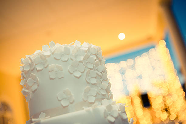 istock Delicious wedding cake with bokeh lights 637175562