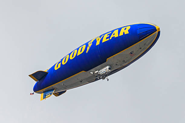 Rose Bowl Good Year Blimp fly-over Pasadena, California,USA-January 2,2017. Good Year Blimp airship fly-over at the 2017 Rose Bowl Game in Pasadena, California. The 2017 Rose Bowl Game featured a fly-over by the B2 bomber during the National Anthem and aerial coverage of the event by the iconic Good Year blimp. celebrity endorsements stock pictures, royalty-free photos & images