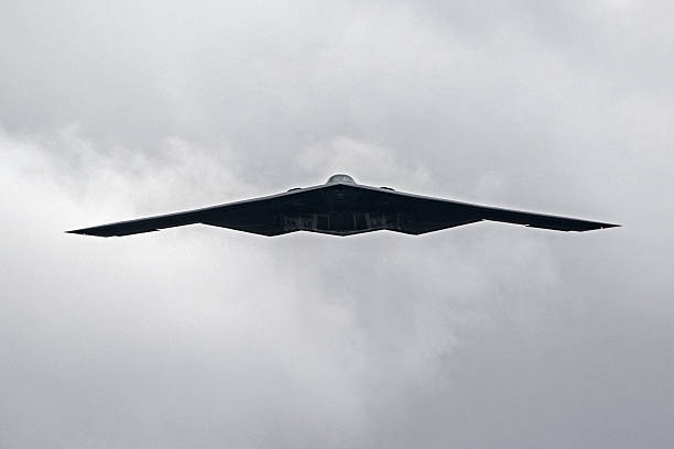Pasadena, California, USA-January 2,2017. B2 stealth bomber flying over 2017 Rose Bowl College Football Game in Pasadena, California. The 2017 Rose Bowl Game featured a fly-over by a US Military B2 stealth jet bomber and the weather was unusually cloudy and cold for Southern California.
