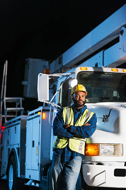 istock African American man with cherry picker truck 637179738
