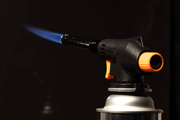 istock gas burner - the tool is lit a blue flame 637179988